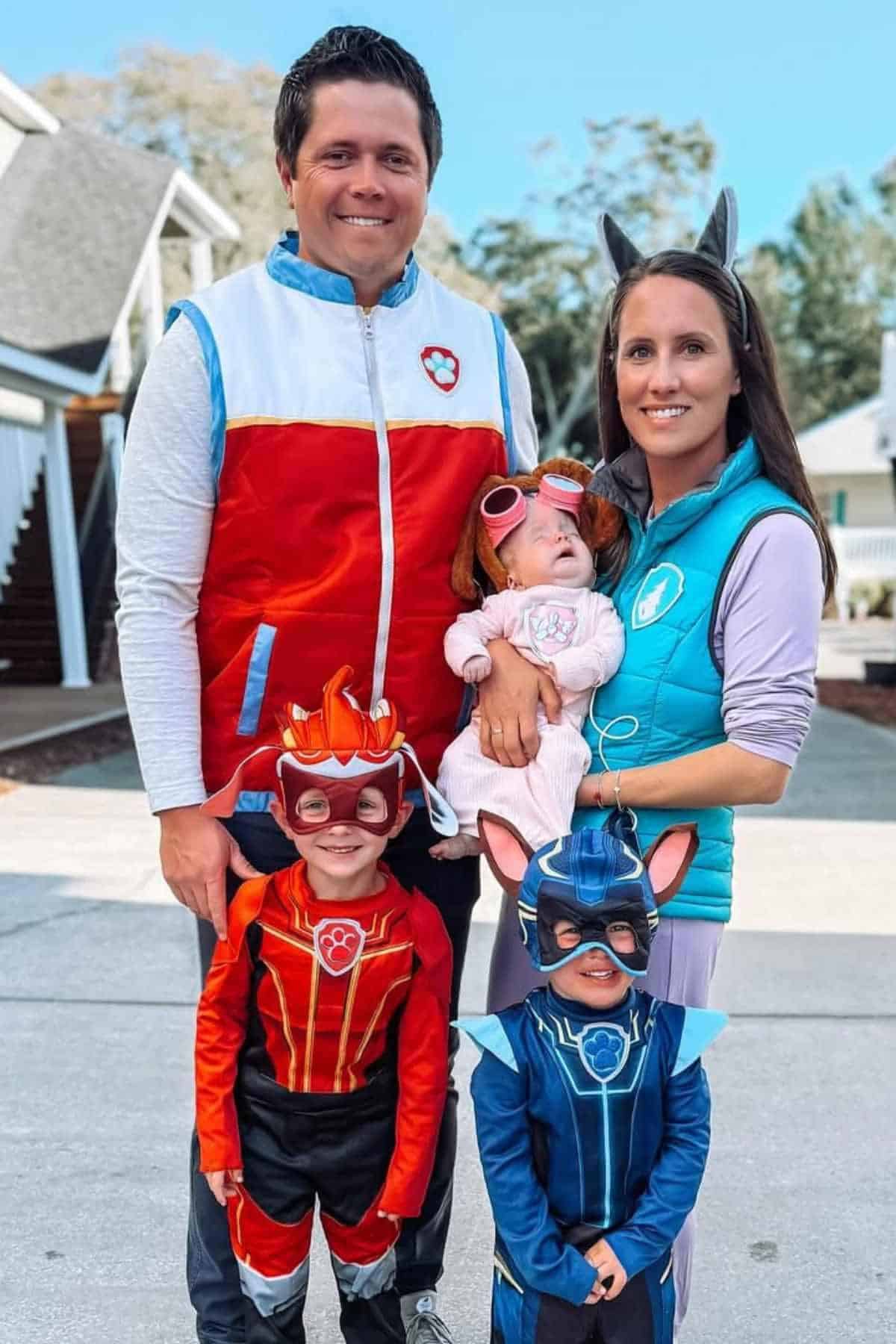 A family of five wearing costumes inspired by Paw Patrols.