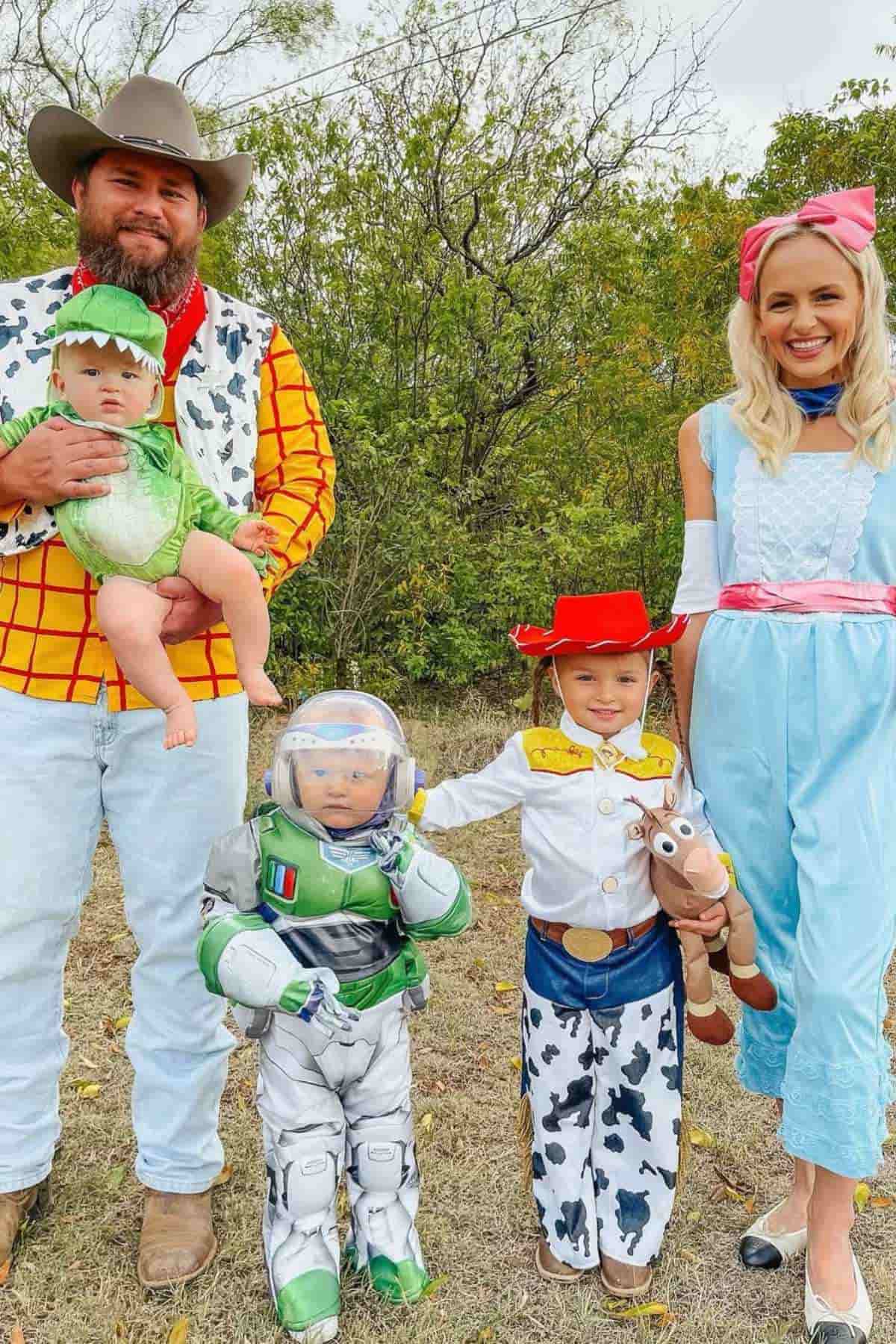 A family of five wearing wearing character costumes from Toy Story.