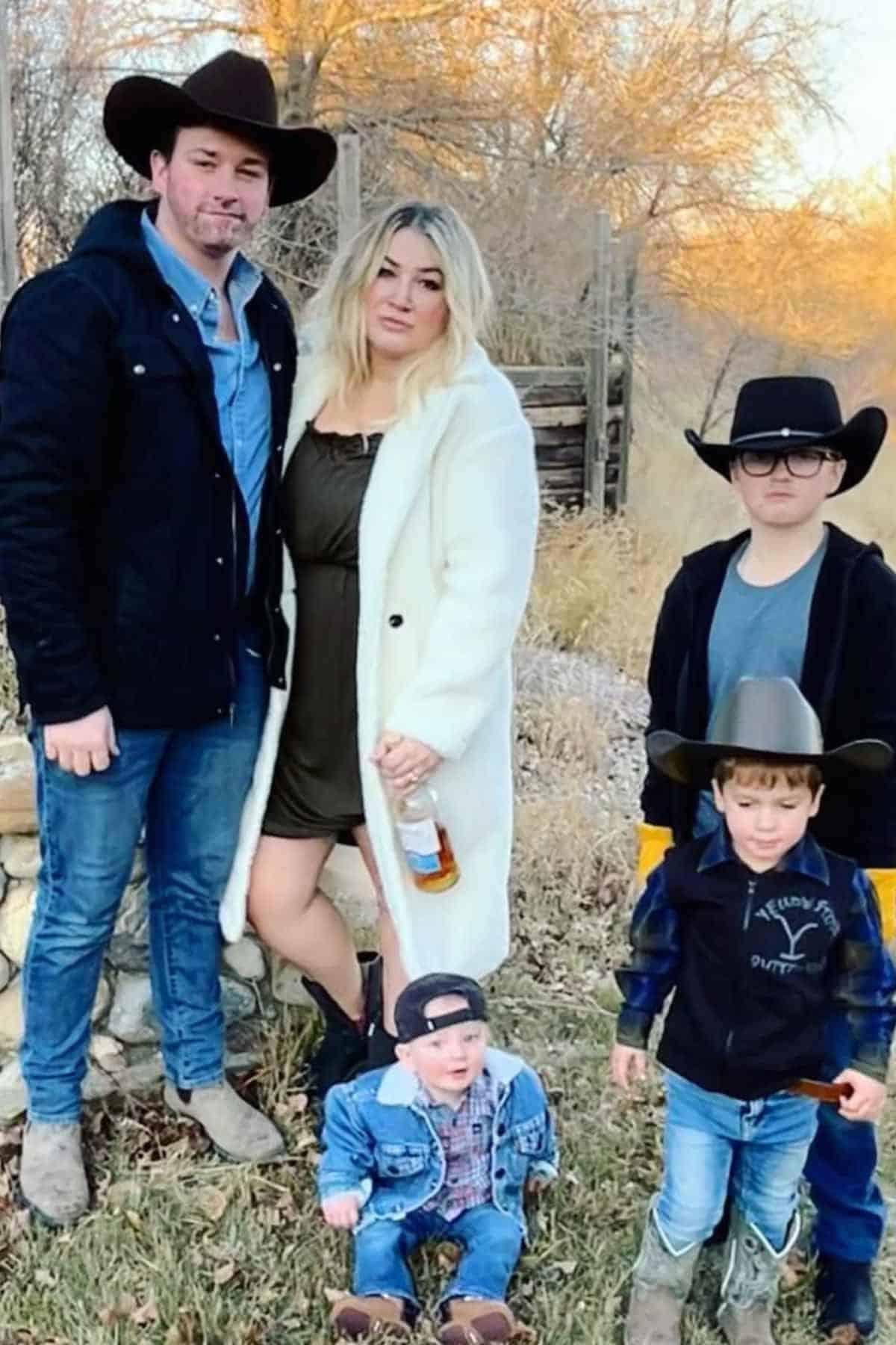 A family of five wearing costumes inspired by Yellowstones Ranch.