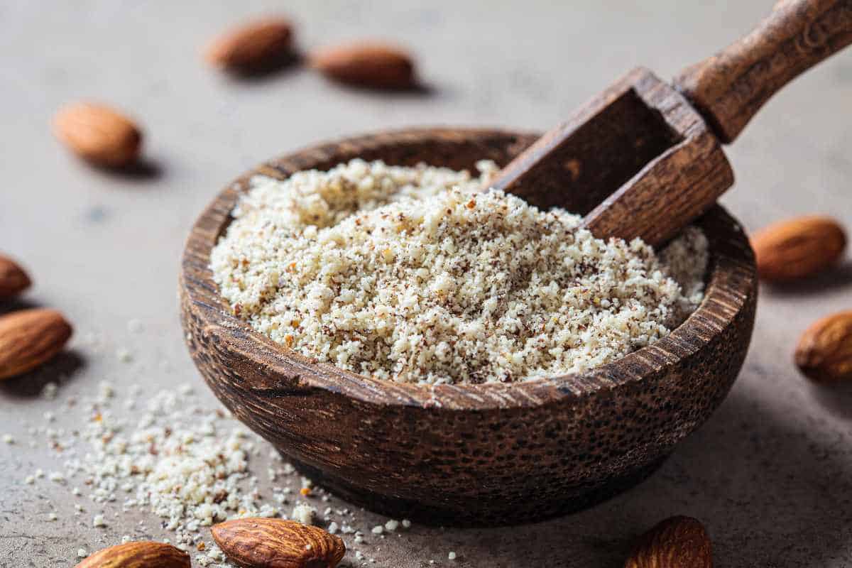 Almond flour in a wooden bowl.