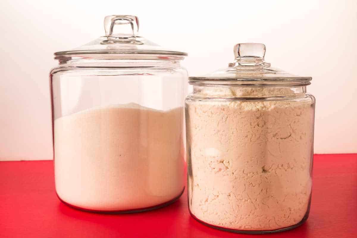 Two glass jars filled with white flour.