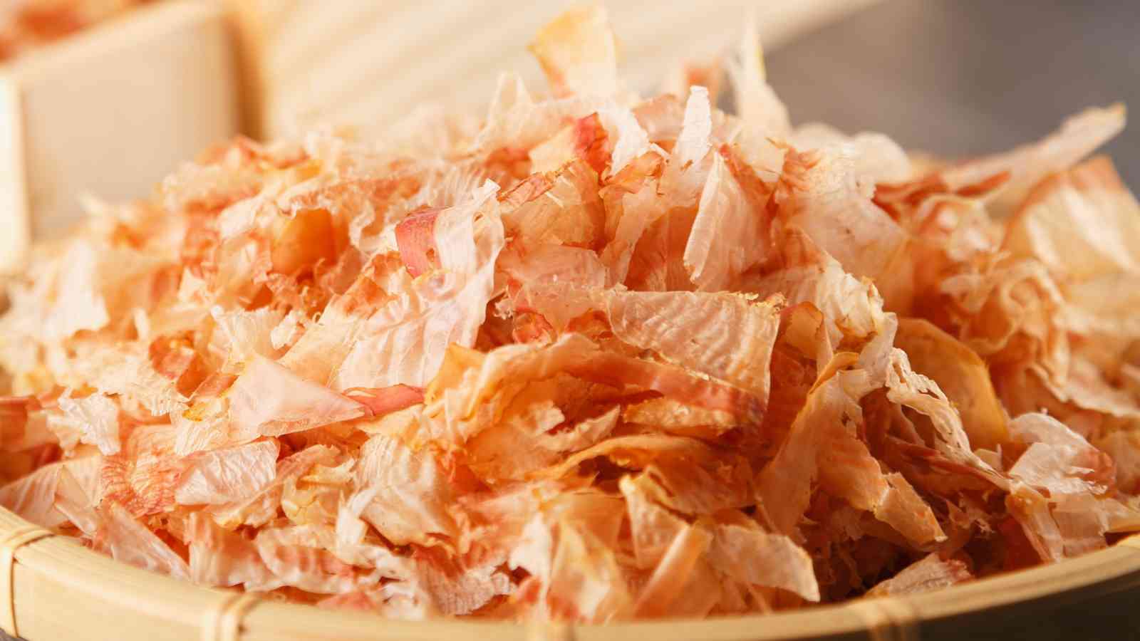 A close-up of a pile of dashi on a wooden surface.