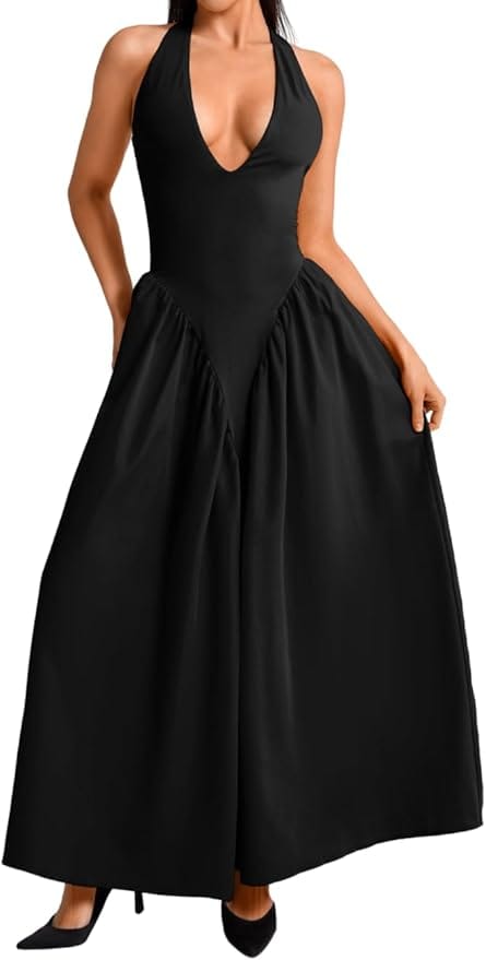 Woman wearing a sleeveless black halter-neck dress with a deep V-neckline and wide, flowing skirt, paired with black heels.