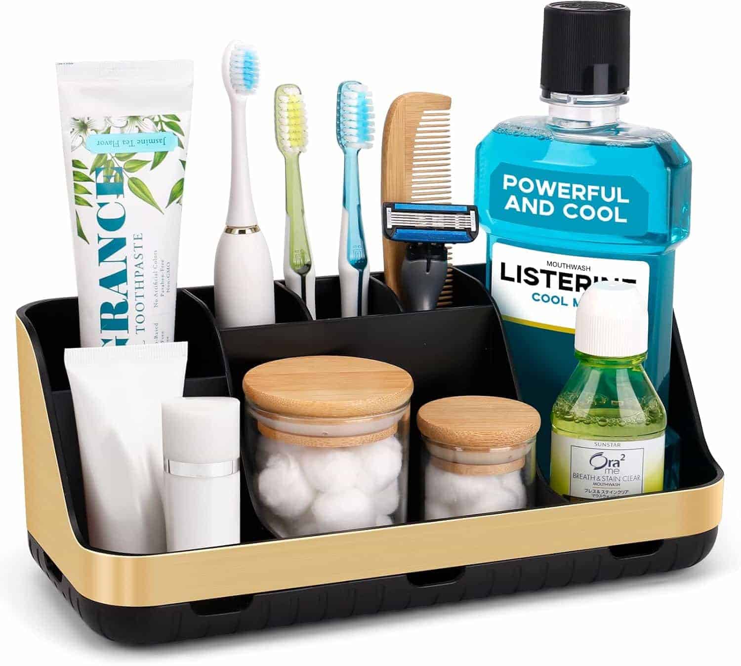 A black and gold bathroom organizer holding toothbrushes, toothpaste, mouthwash, cotton swabs, cotton balls, a comb, razor, and small toiletry bottles.