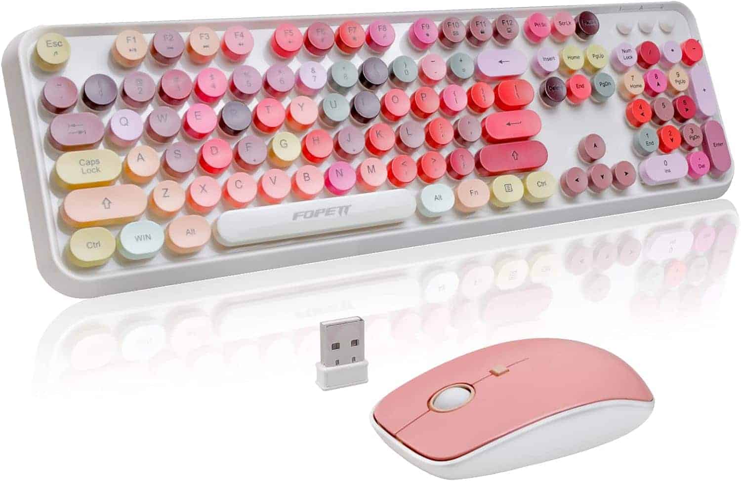 A pastel-colored wireless keyboard with round keys and matching pink wireless mouse, accompanied by a small USB receiver.