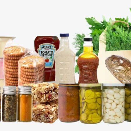 An assortment of packaged and jarred foods, including yogurt, crackers, condiments, spices, pickled vegetables, bread, leafy greens, and honey, arranged on a white background.