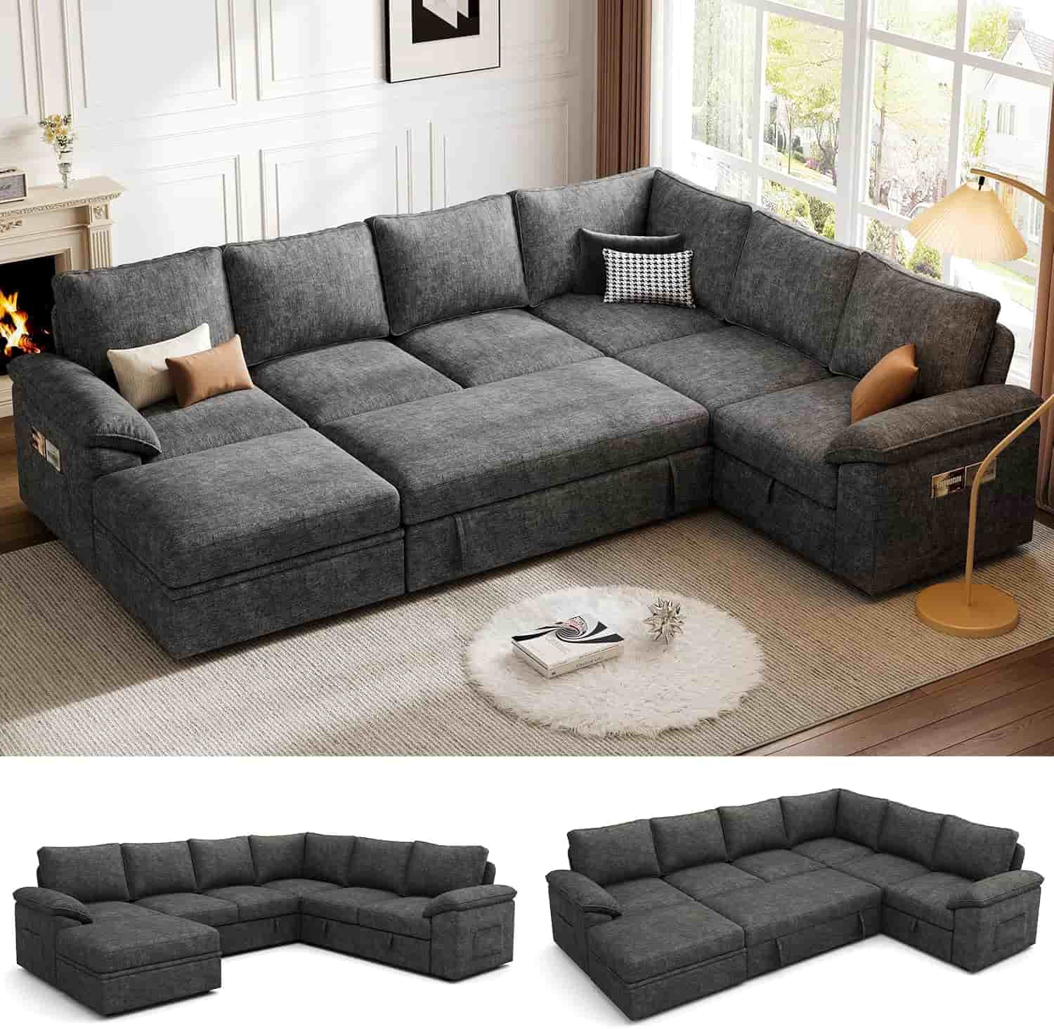 A large, dark gray L-shaped sectional sofa with cushions and pillows is placed in a modern, well-lit living room with wood flooring and a white rug.