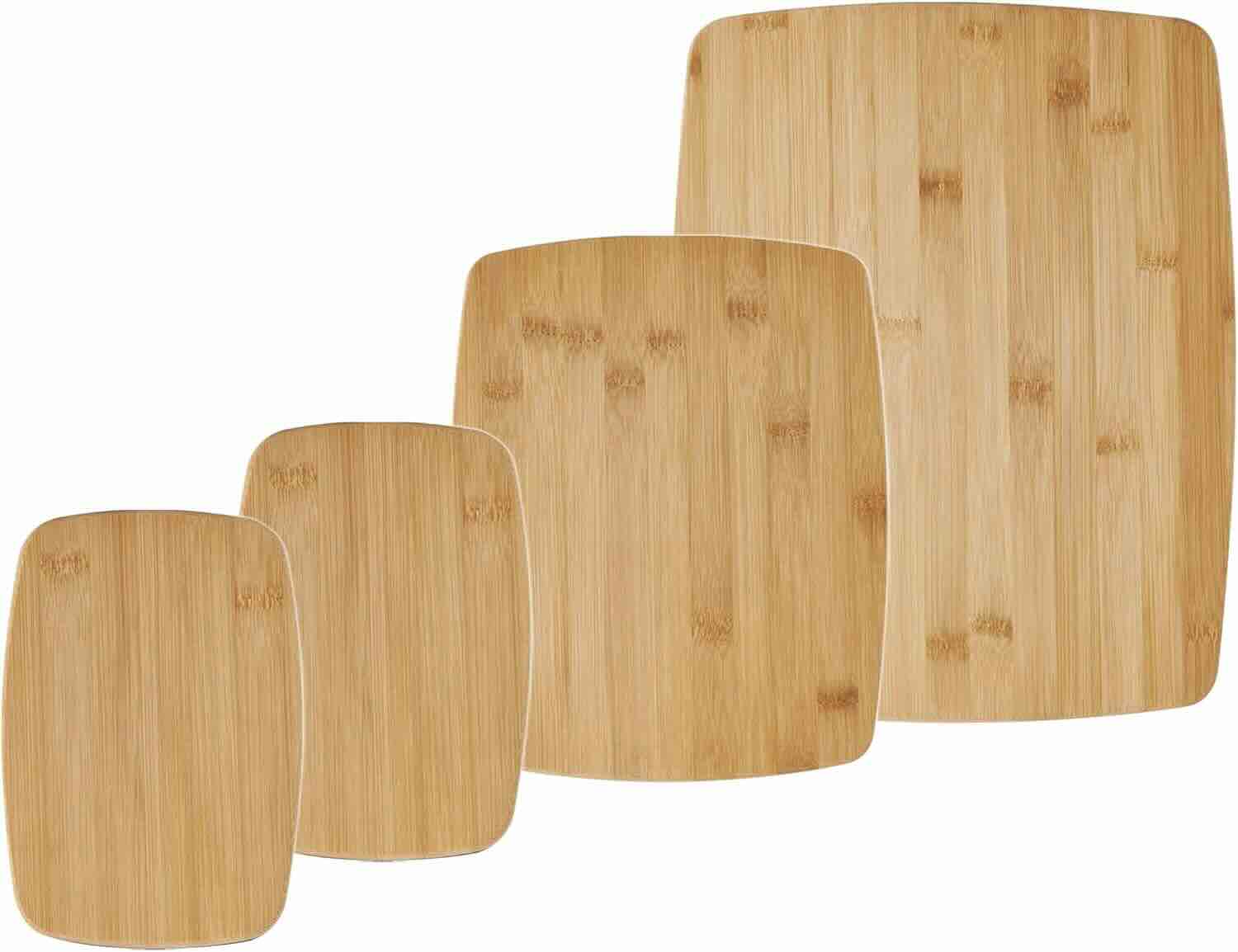 Four rectangular bamboo cutting boards of varying sizes arranged in a row on a white background.