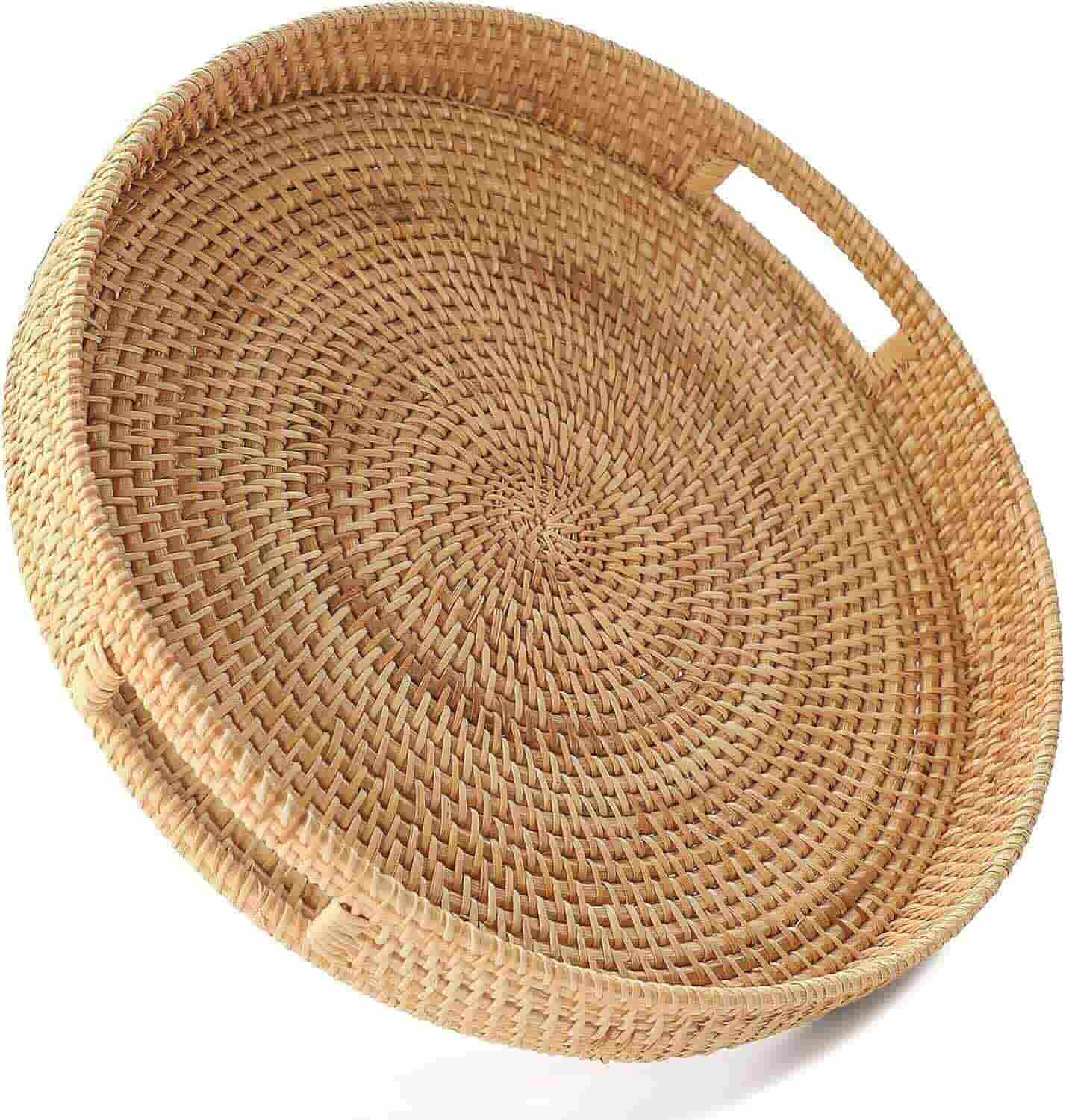 A round, woven wicker serving tray with built-in handles on opposite sides.