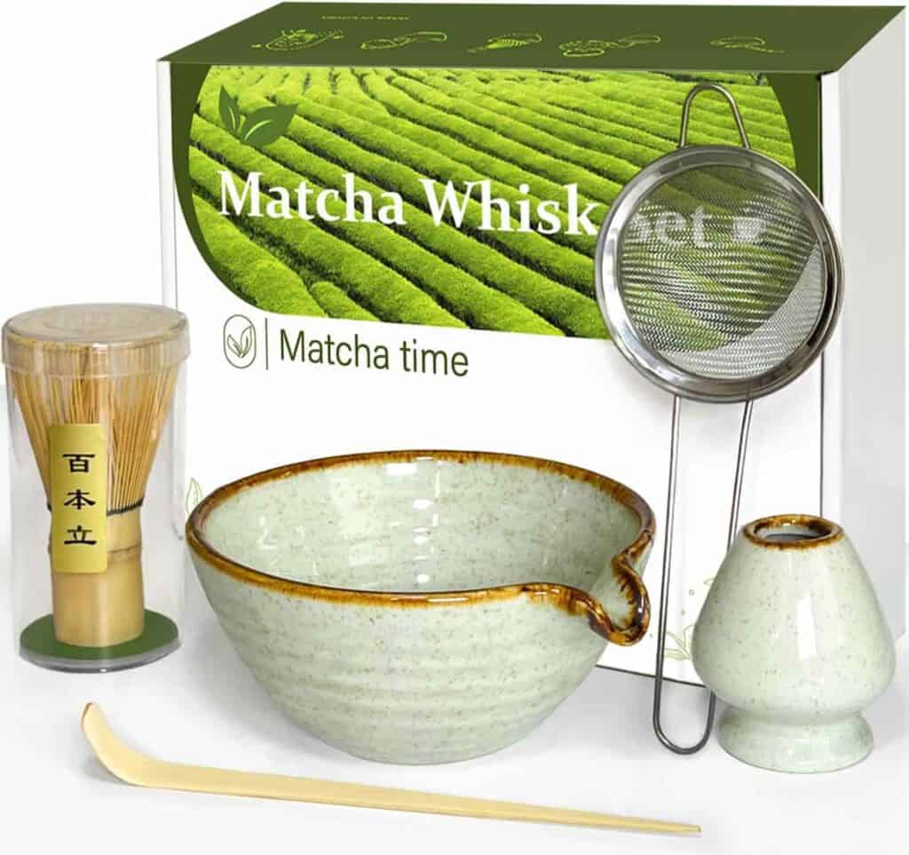 A matcha tea set including a whisk, strainer, bowl, whisk holder, scoop, and packaging box labeled "Matcha Whisk Set" and "Matcha time.