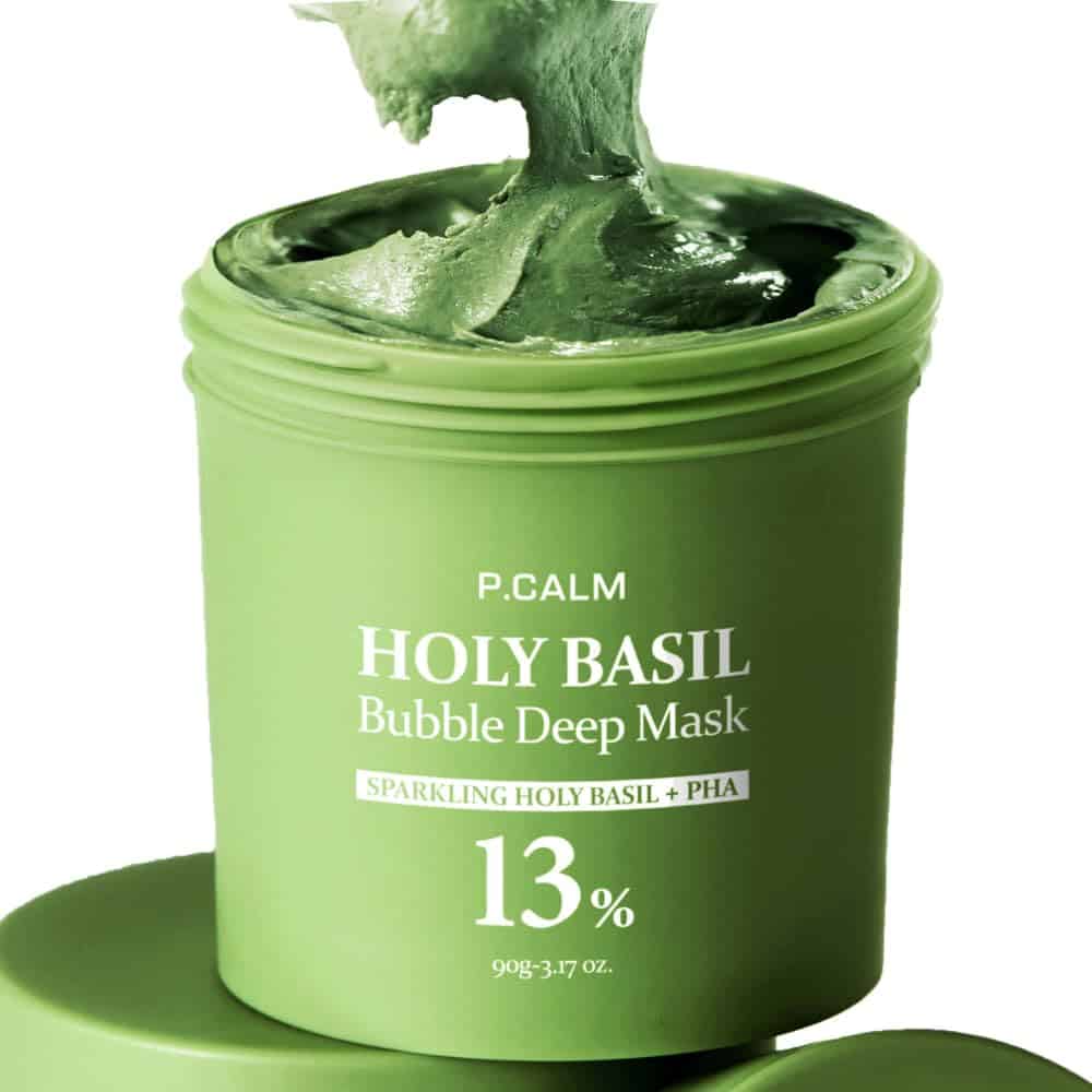 Green jar of P.CALM Holy Basil Bubble Deep Mask with green mask cream visible; label highlights 13% holy basil and PHA content.