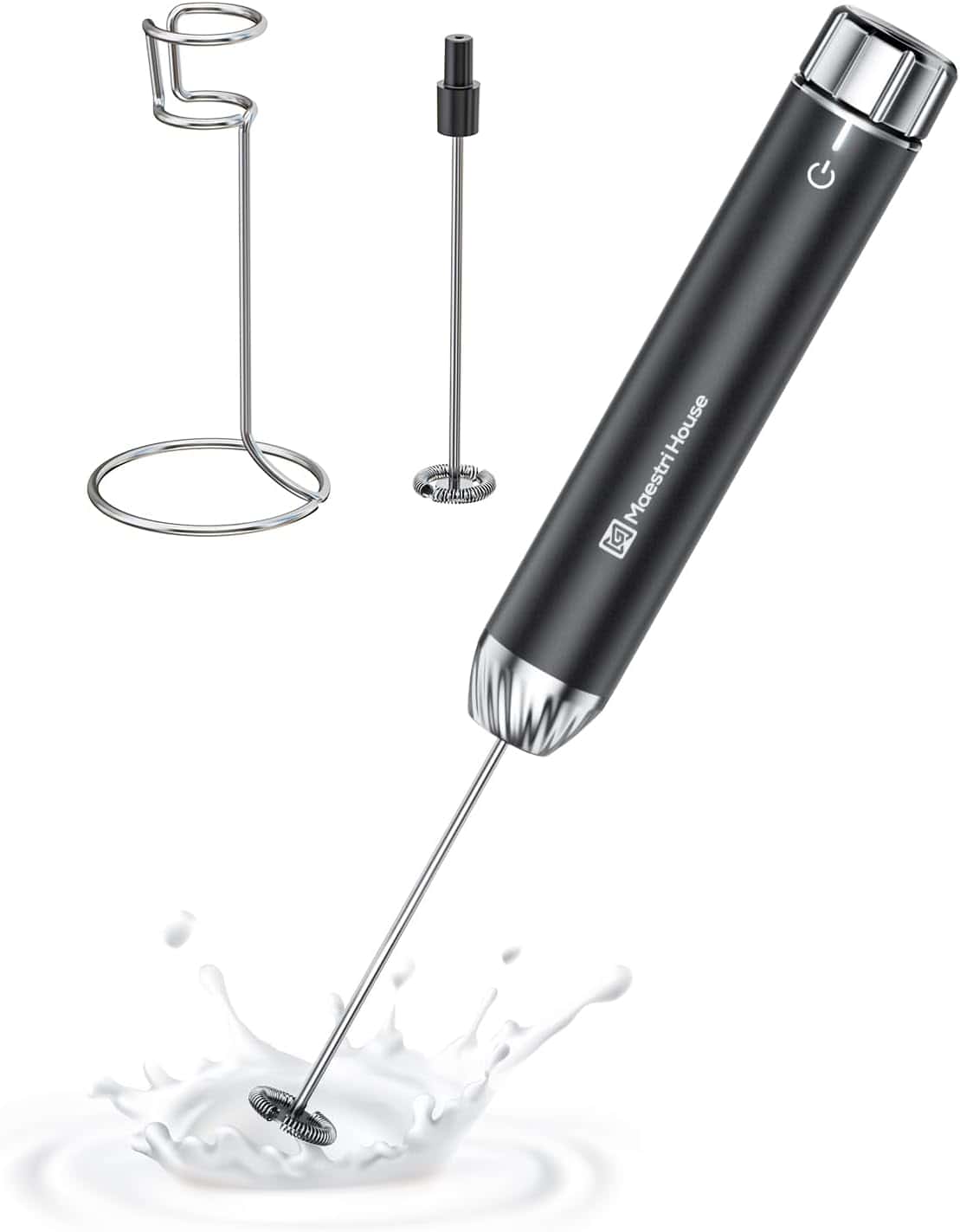 A handheld electric milk frother with a stand, creating a splash in milk.