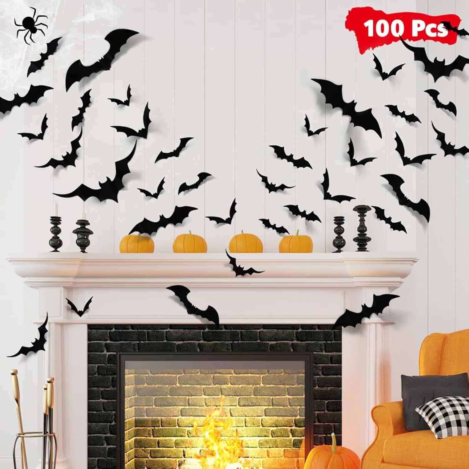 A white mantel decorated with black bat cutouts, small pumpkins, black candlesticks, and a lit fireplace, with a "100 pcs" label in the top right corner.