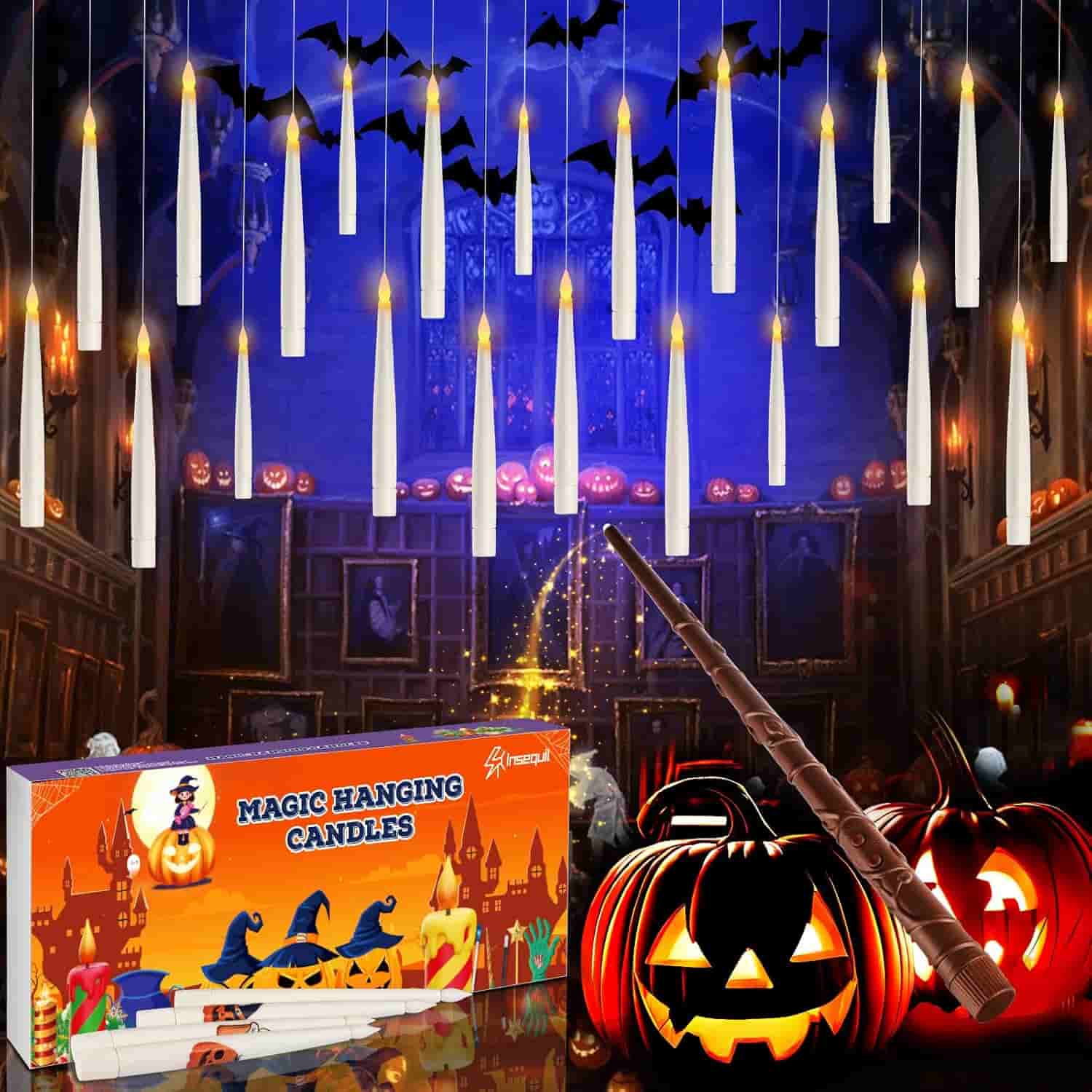 A set of magic hanging candles with LED lights, a toy wand, and Halloween decorations including carved pumpkins and bats in a spooky indoor setting.