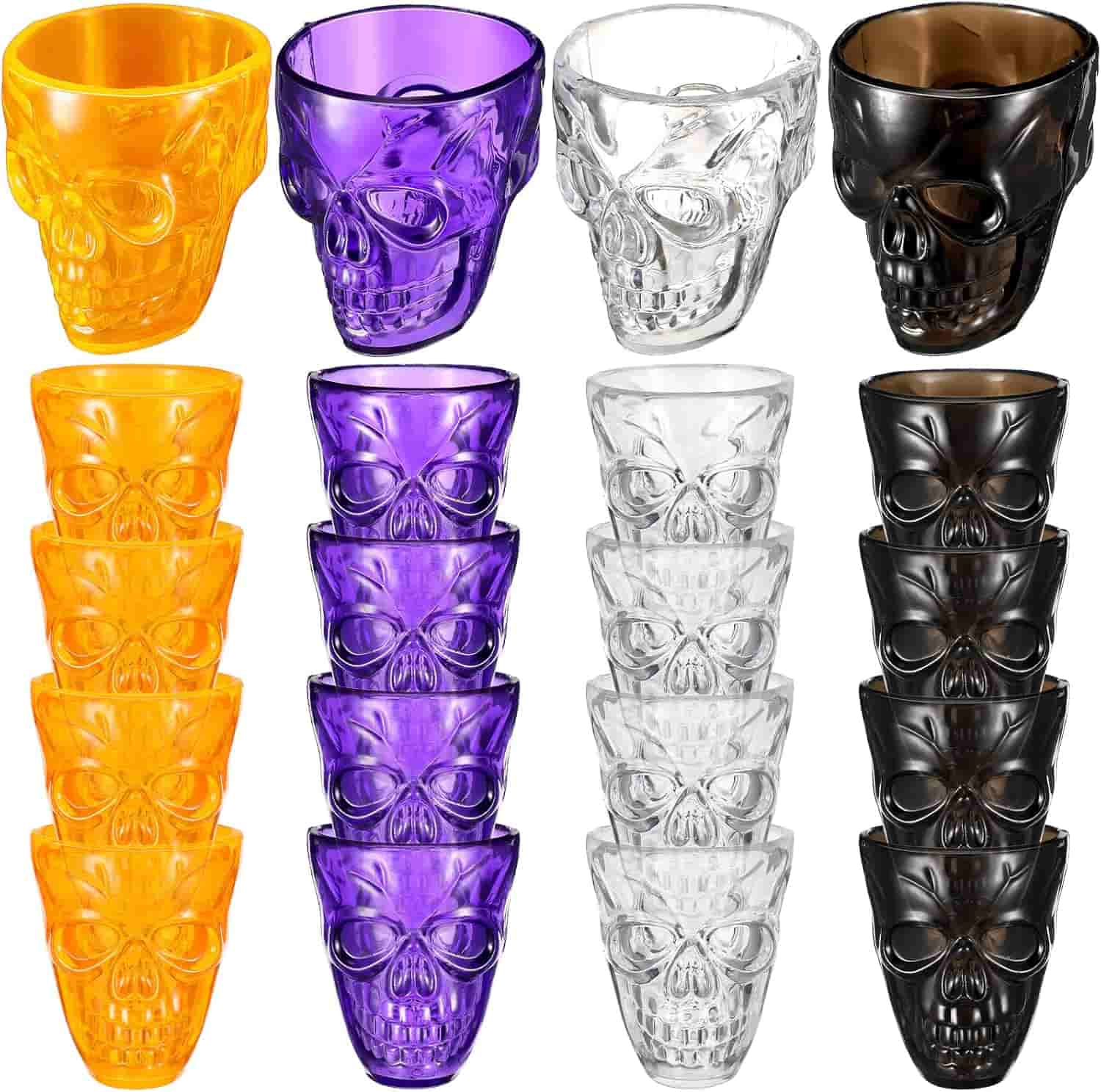 Four colors of skull-shaped shot glasses—orange, purple, clear, and black—are shown in individual and stacked arrangements on a white background.
