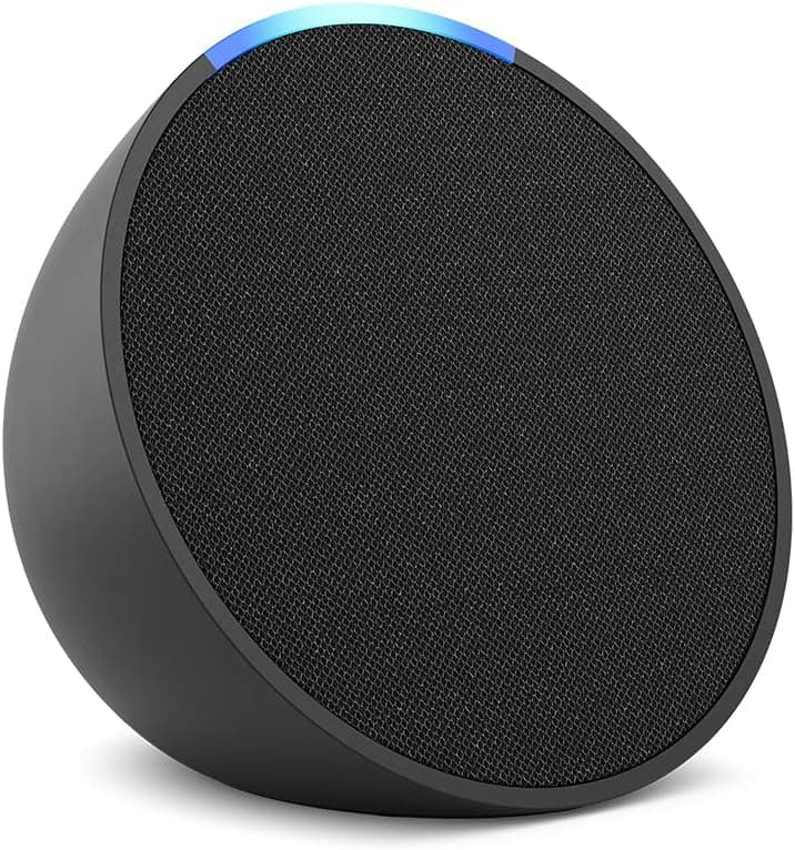 A black, circular smart speaker with a fabric front and a blue LED indicator on top, positioned on a white background.