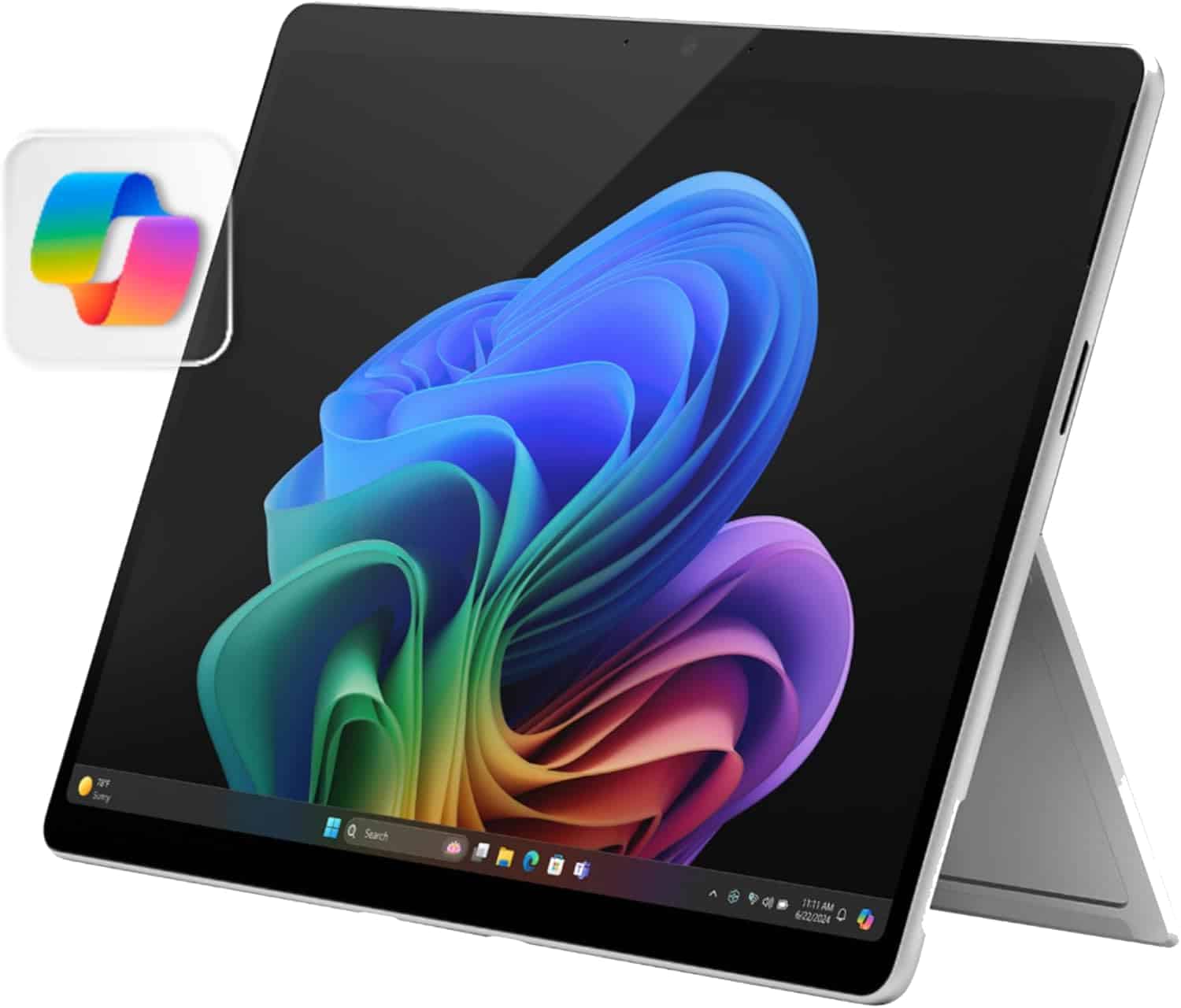 A Microsoft Surface tablet with a Windows 11 wallpaper on the screen, propped up by its built-in kickstand, with a Microsoft Loop app icon visible in the corner.