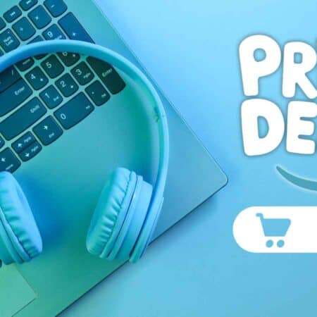 Blue headphones rest on a laptop keyboard next to text reading "Prime Deals" and a clickable shopping cart icon on a blue background.
