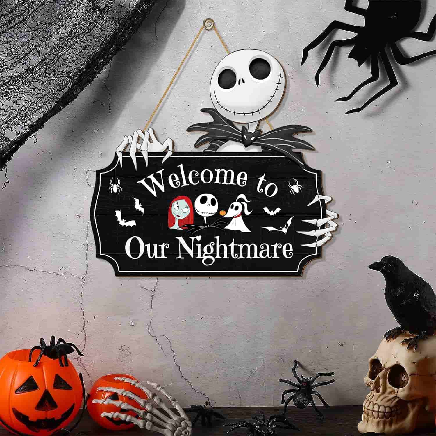 A Halloween-themed scene with a "Welcome to Our Nightmare" sign, surrounded by pumpkins, skulls, a crow, a spider, and web decorations.