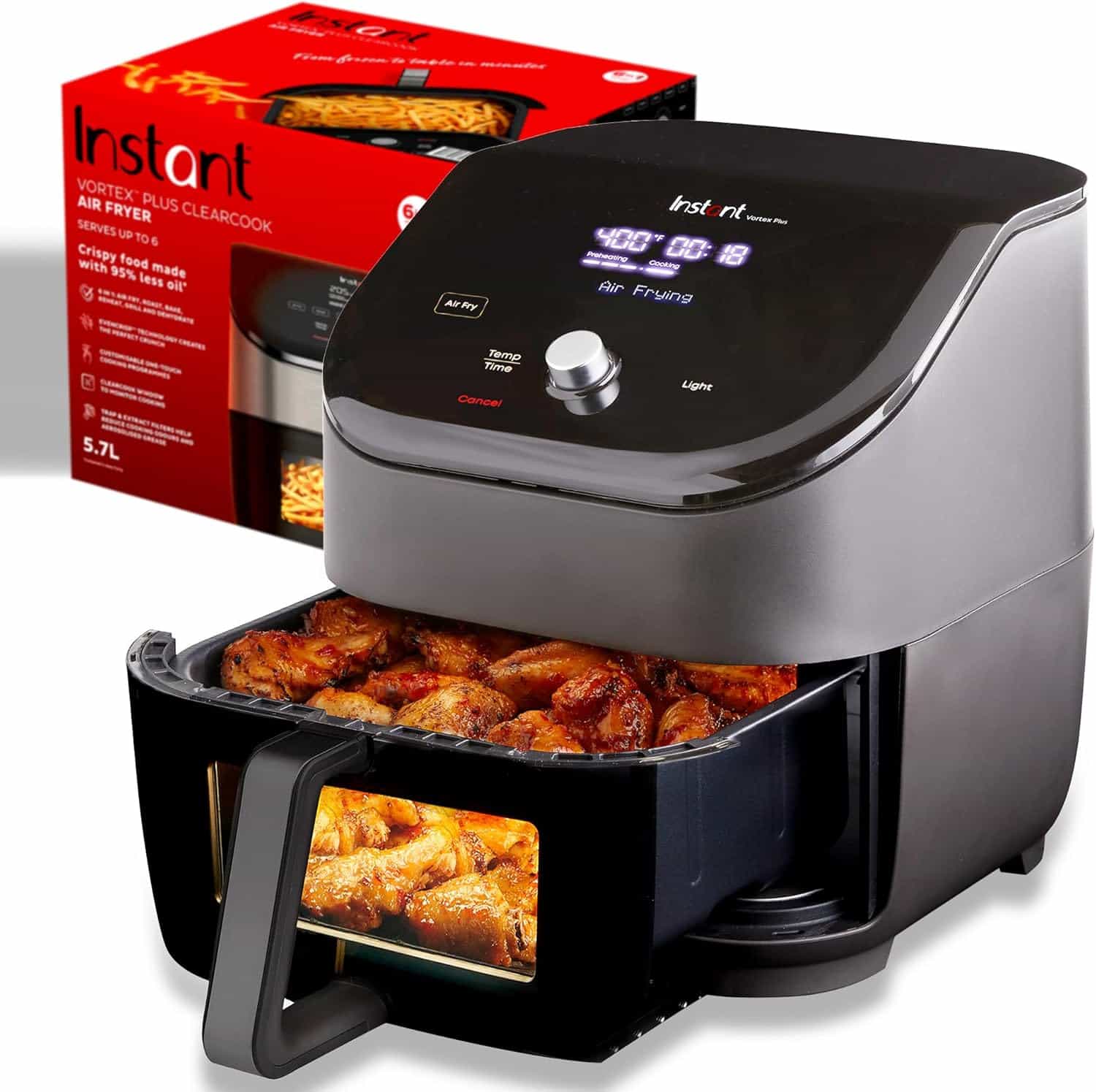 Instant Vortex Plus air fryer with a tray of cooked chicken wings, digital display active, and product box in the background.