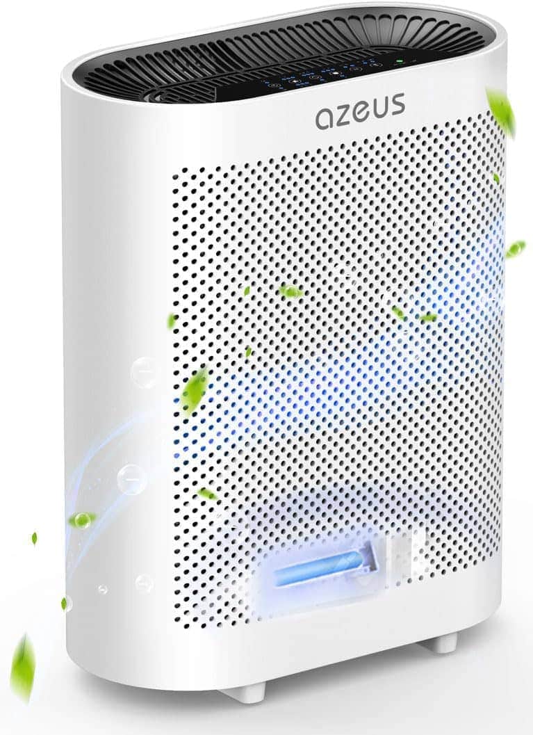 White AZEUS air purifier with perforated front panel, a visible blue light, and green leaves around, indicating clean air or air purification in progress.