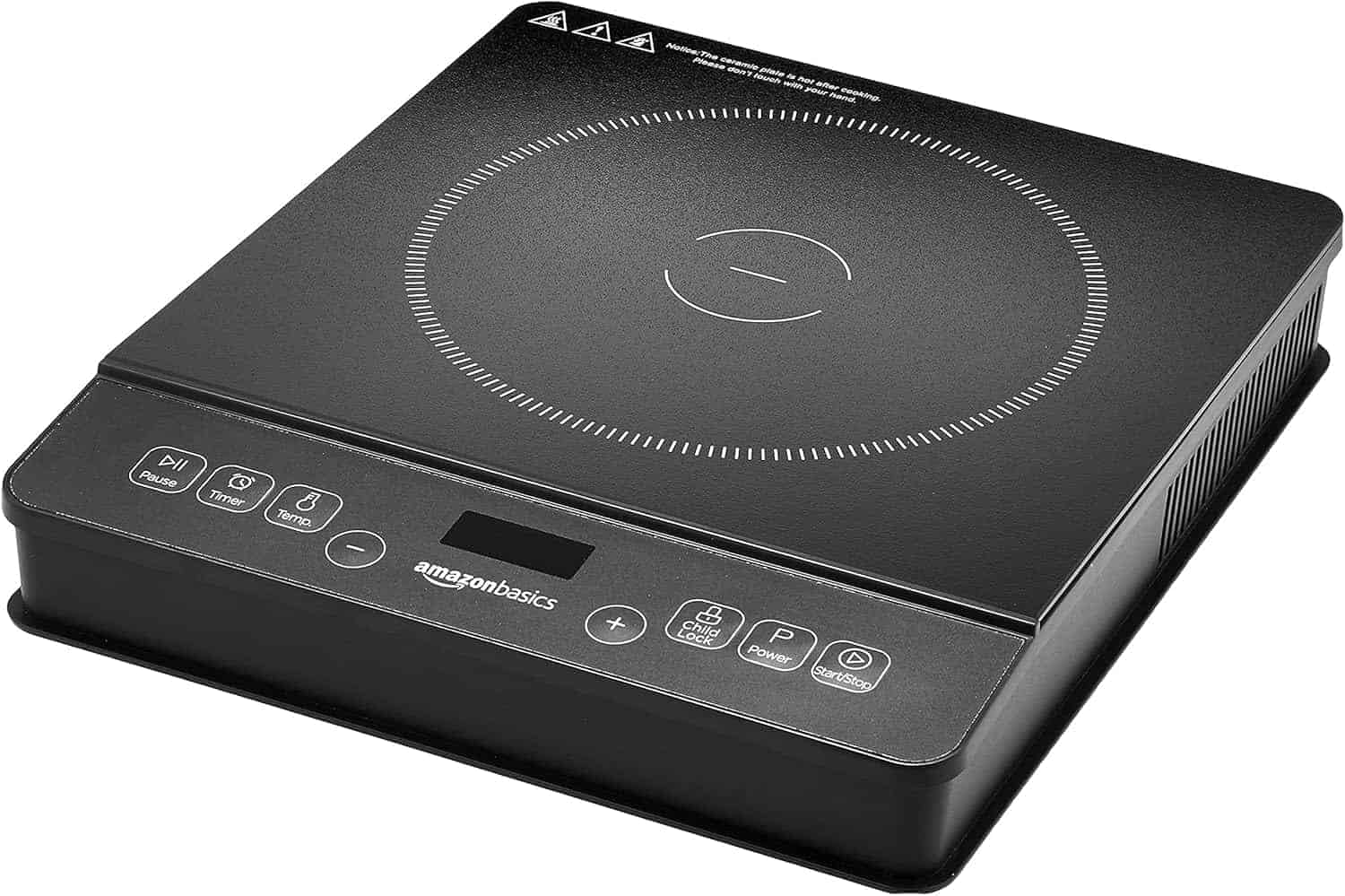 A black AmazonBasics induction cooktop with a circular heating zone and touch control buttons on the front panel.