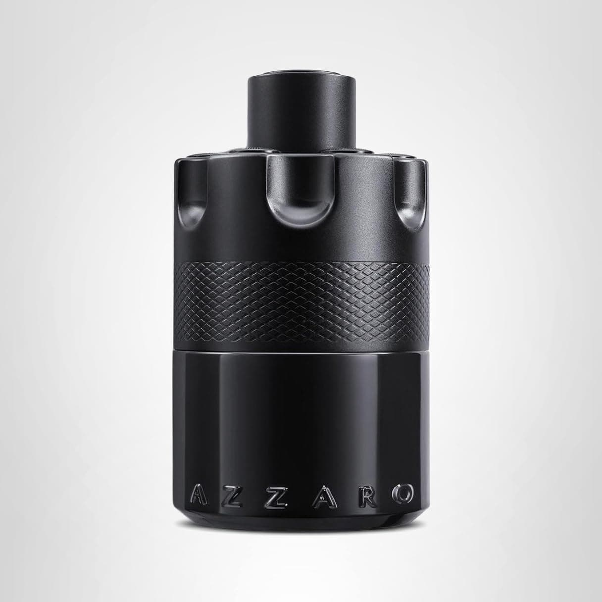 A matte black cylindrical bottle of Azzaro perfume with a textured middle section and raised lettering at the base, set against a plain light background.