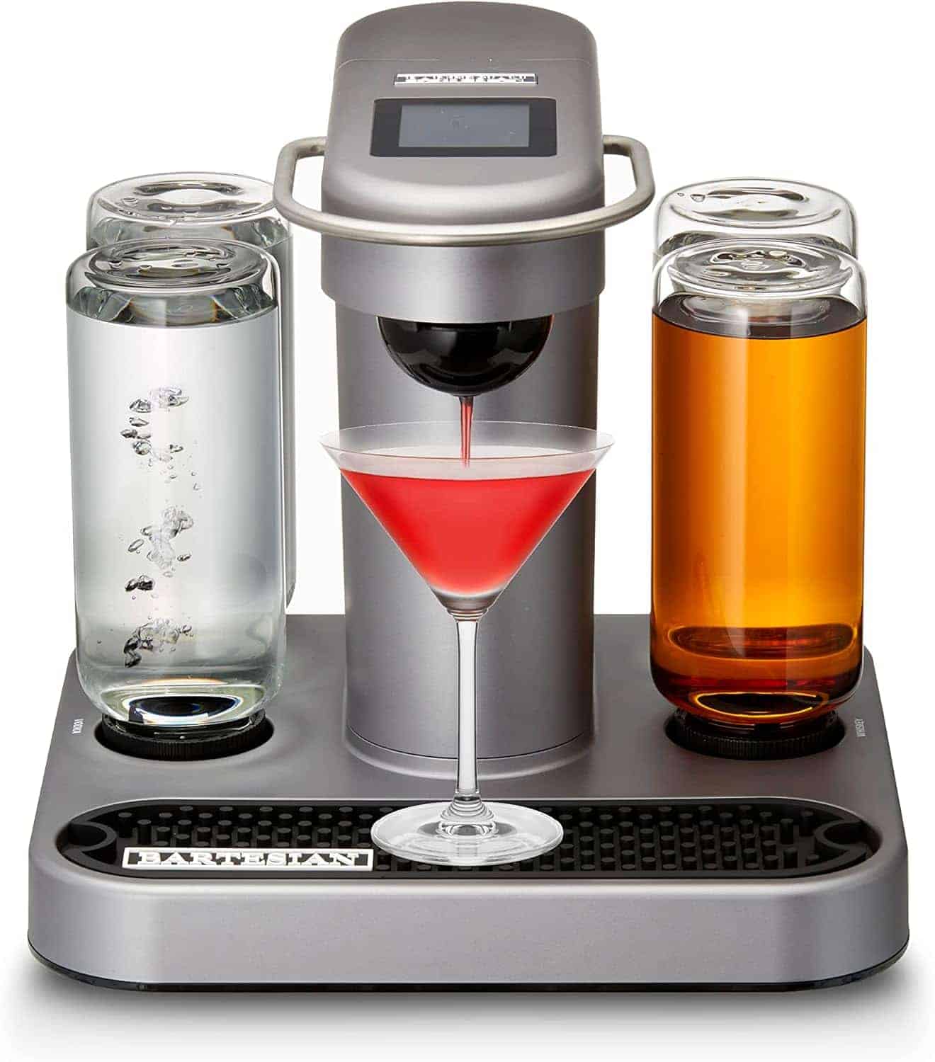 A countertop drink machine dispensing a red cocktail into a martini glass, with two clear canisters on either side containing water and an amber liquid.
