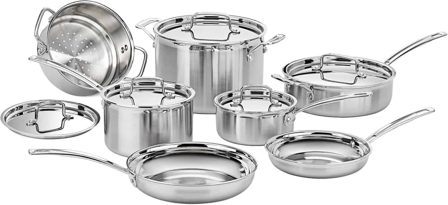 A stainless steel cookware set with various pots, pans, and lids arranged on a white background.