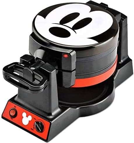A black and red waffle maker featuring a Mickey Mouse face design on the lid and control panel.