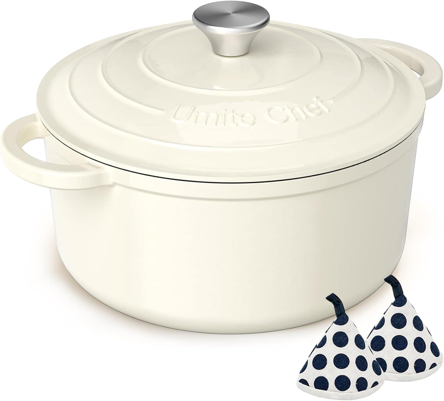 A cream-colored cast iron Dutch oven with lid, two handles, and "Unite Chef" embossed on top; two polka-dotted fabric pot holders are placed in front.