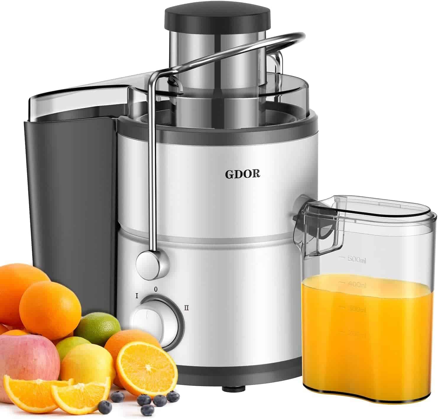 A silver and black electric juicer labeled "GDOR" sits next to a container of orange juice and assorted fruits including oranges, apples, and lemons.