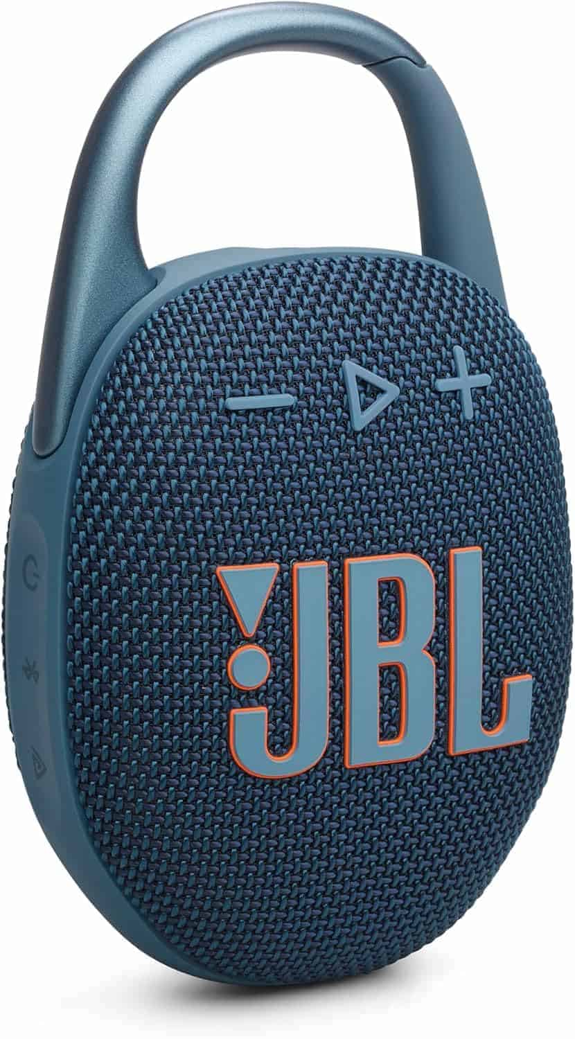 A blue JBL portable Bluetooth speaker with a fabric cover, prominent orange JBL logo, control buttons, and a built-in carabiner clip.