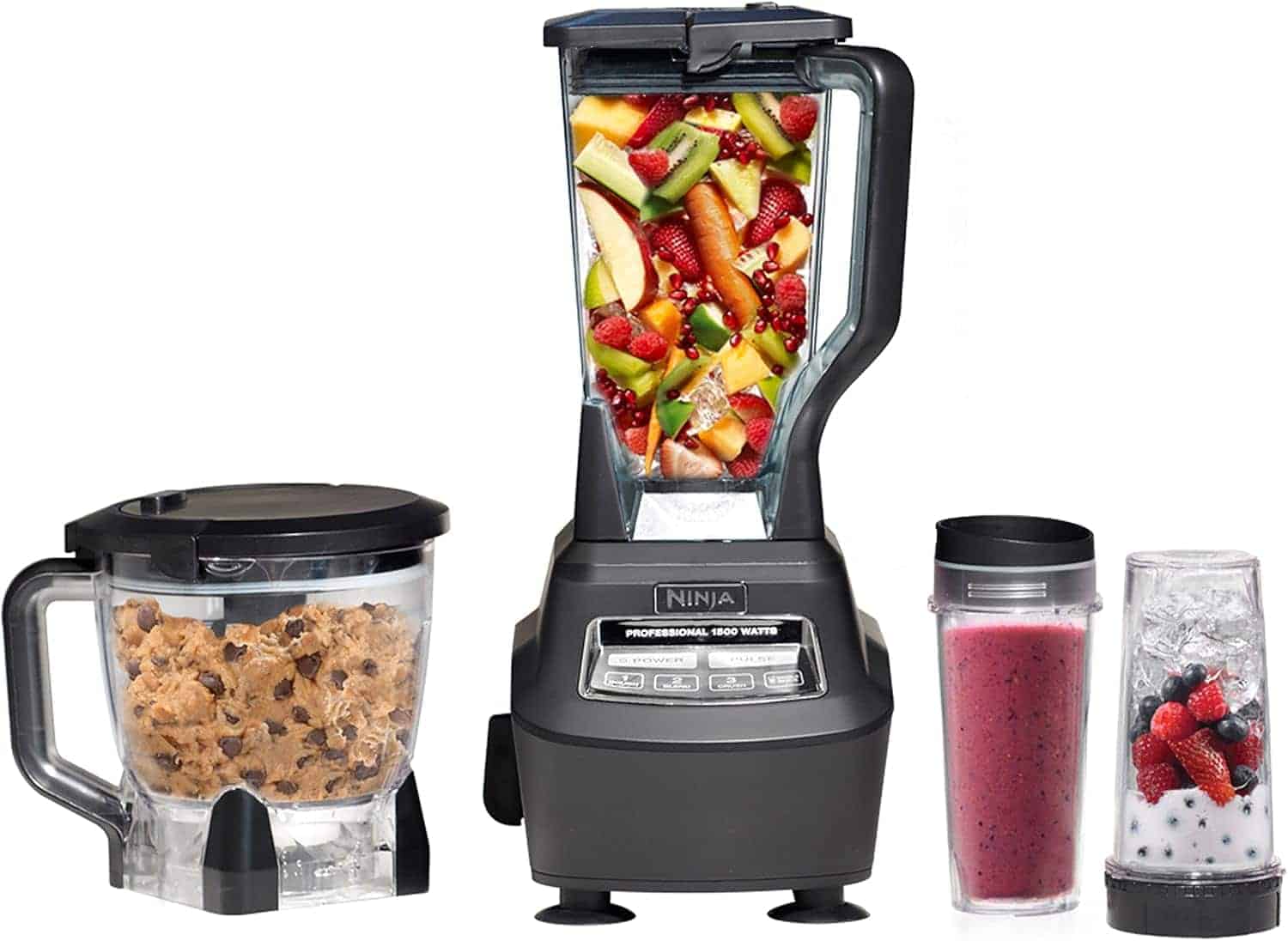A Ninja blender set with a main blender jar filled with assorted fruit, a food processor bowl with cookie dough, a cup with a smoothie, and a small cup with yogurt and berries.