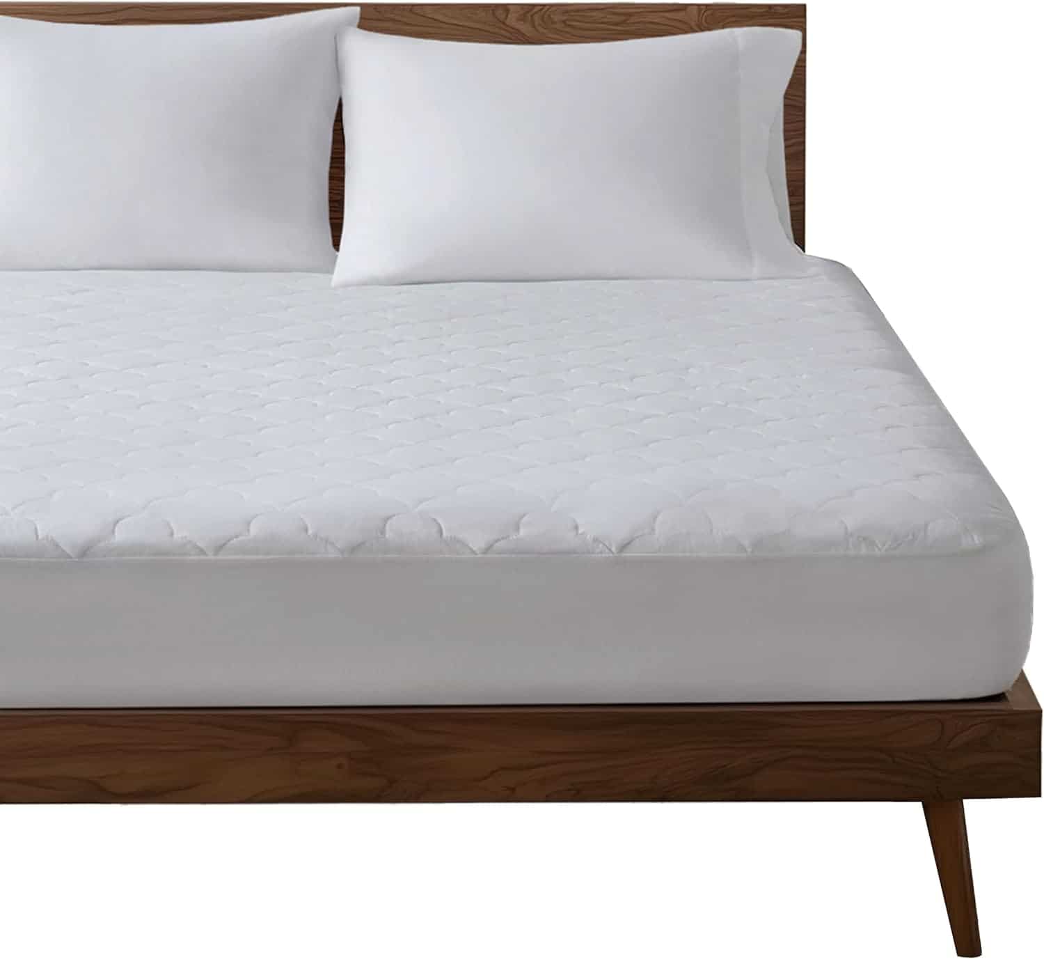 A wooden bed frame with a white mattress, two white pillows, and a white quilted mattress cover.
