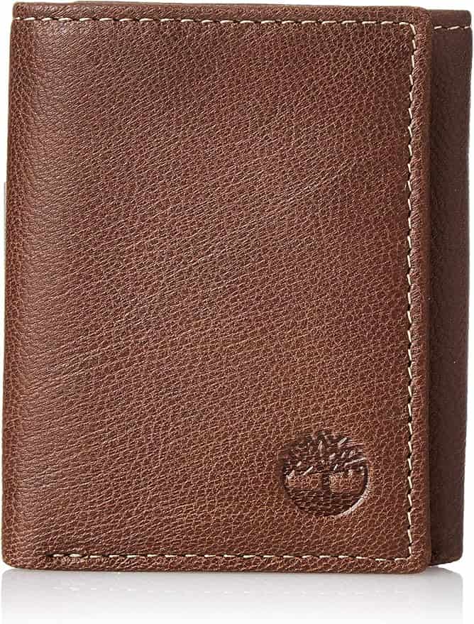 Brown leather trifold wallet with visible stitching and an embossed Timberland logo in the bottom right corner.