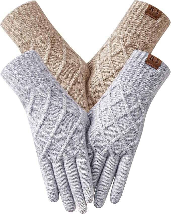 Two pairs of knit gloves, one beige and one light gray, both featuring a diamond pattern and a small brown tag on the wrist.