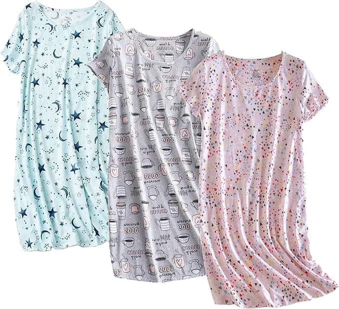 Three short-sleeve nightgowns in different prints: blue with stars and moons, grey with coffee-themed icons, and pink with small colorful hearts.