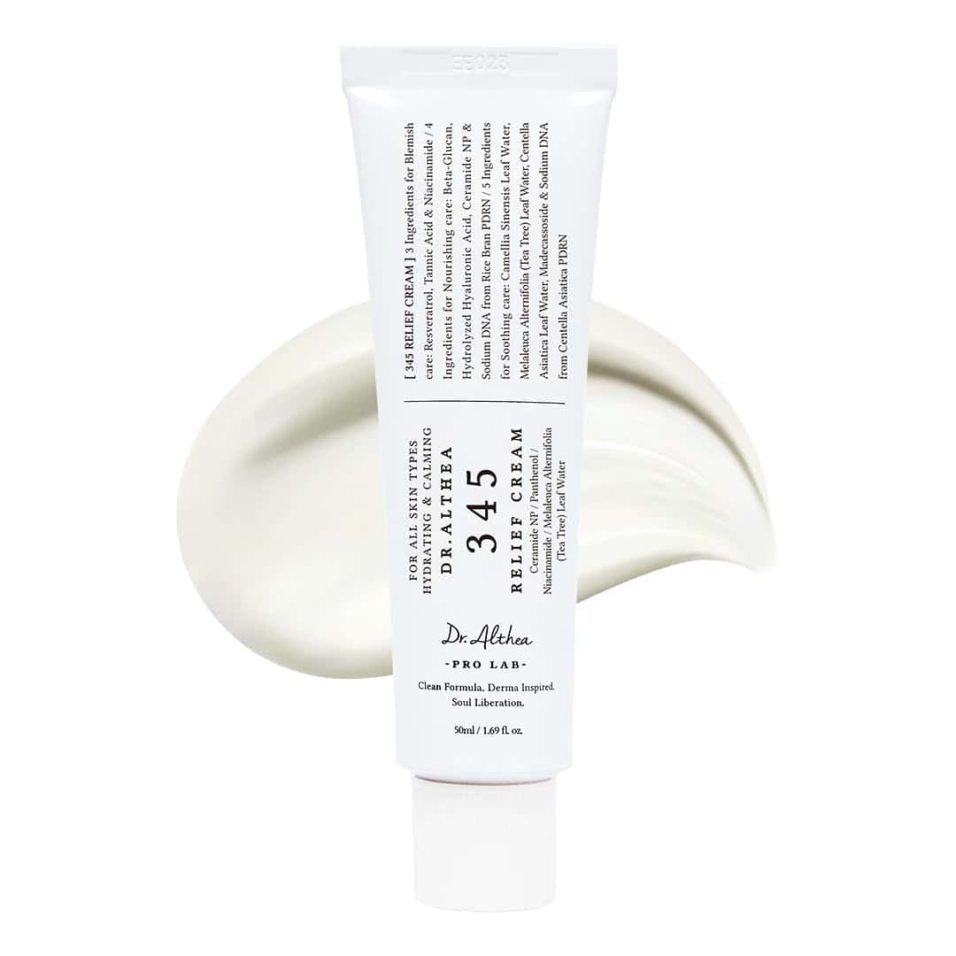 A white tube labeled "Dr. Althea 345A TEA RELIEF CREAM" is displayed in front of a swirl of cream on a white background.