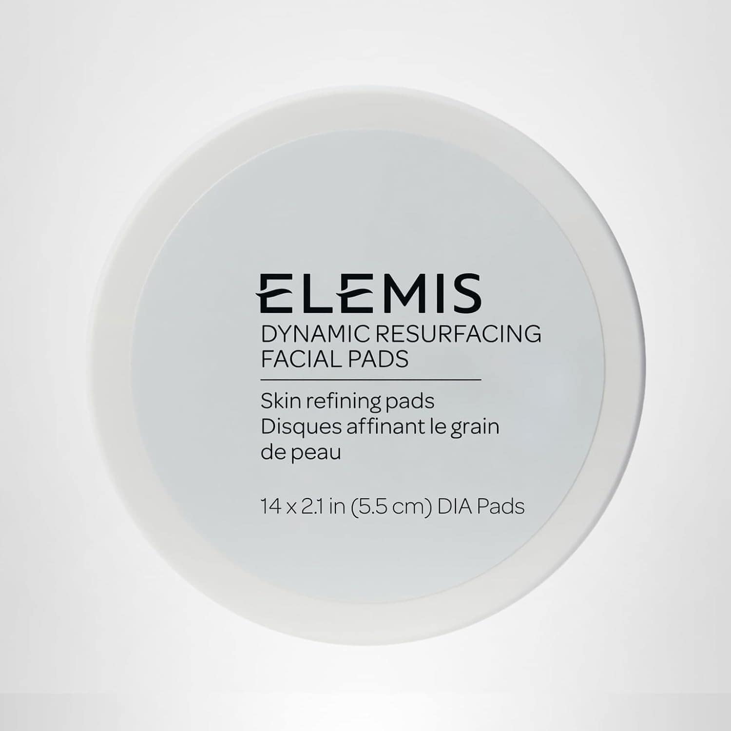 A round white container labeled "Elemis Dynamic Resurfacing Facial Pads" with product details in English and French on the lid.