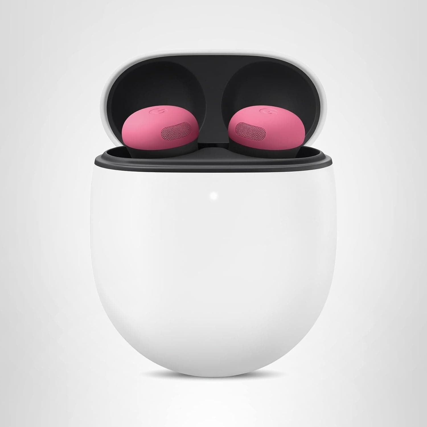 A white wireless earbud charging case is open, showing two pink earbuds resting inside against a black interior.