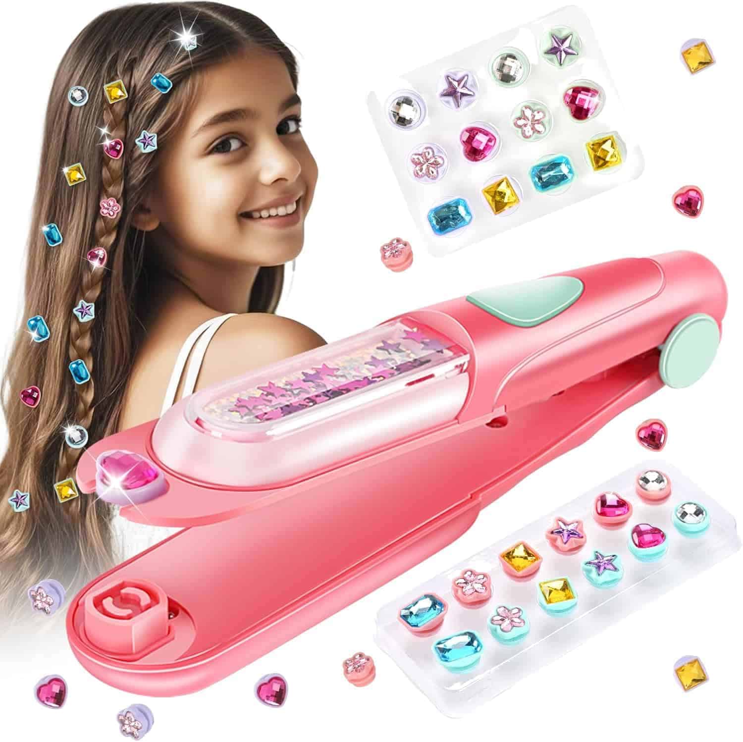 A girl with long brown hair decorated with colorful gems, next to a pink hair bedazzler tool and trays of assorted gem decorations.