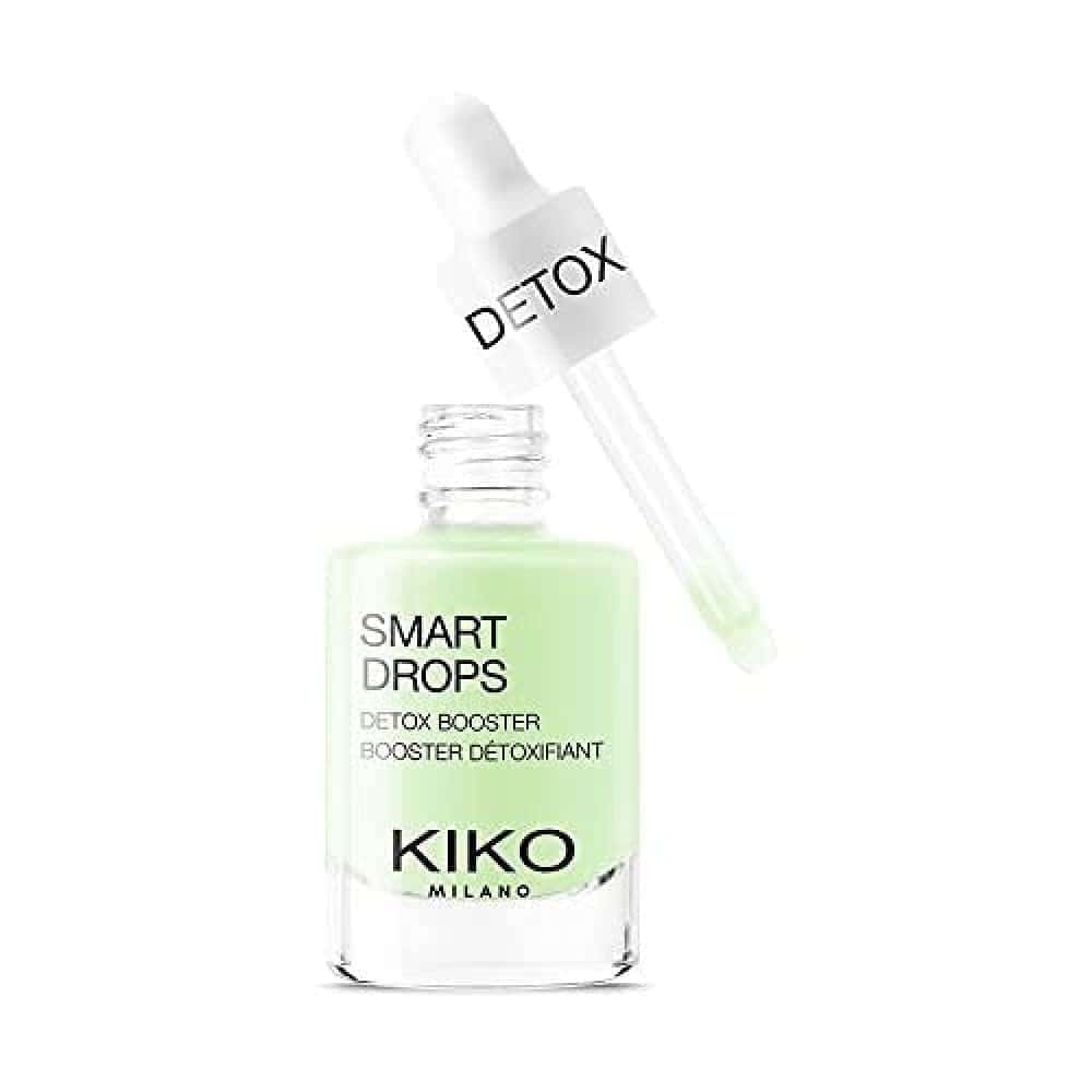A bottle of Kiko Milano Smart Drops Detox Booster with a dropper labeled "Detox" resting on top; the liquid inside is light green.