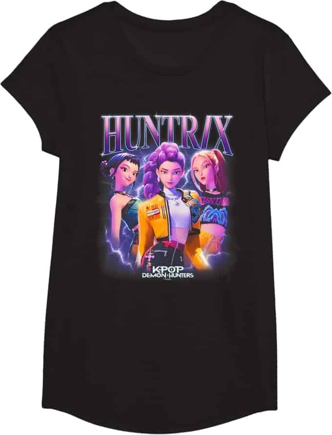 Black T-shirt featuring an illustrated graphic of three animated girls under the title "HUNTRAX" with "KPOP DEMON HUNTERS" written below.