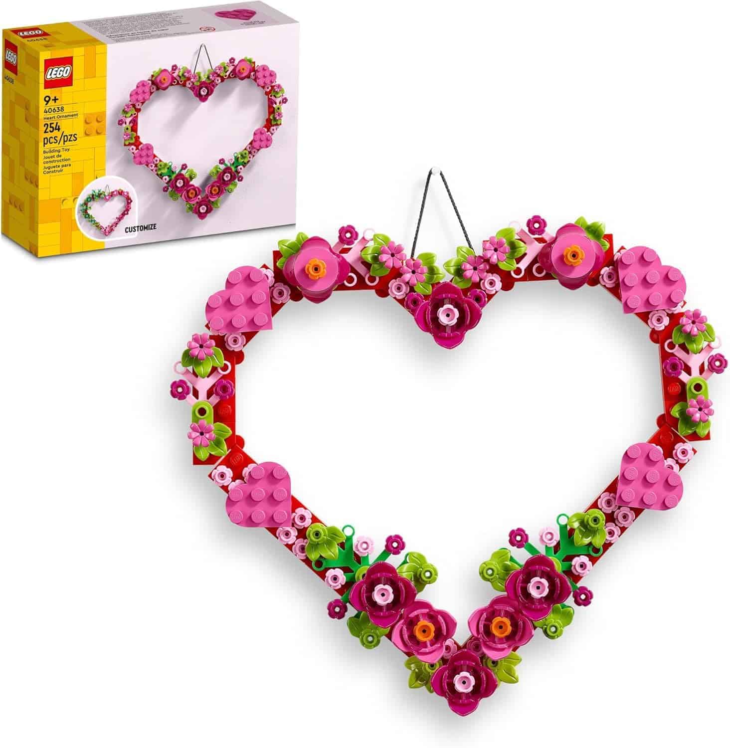 LEGO set featuring a heart-shaped floral wreath made of pink, red, and green bricks, with the box shown in the background.
