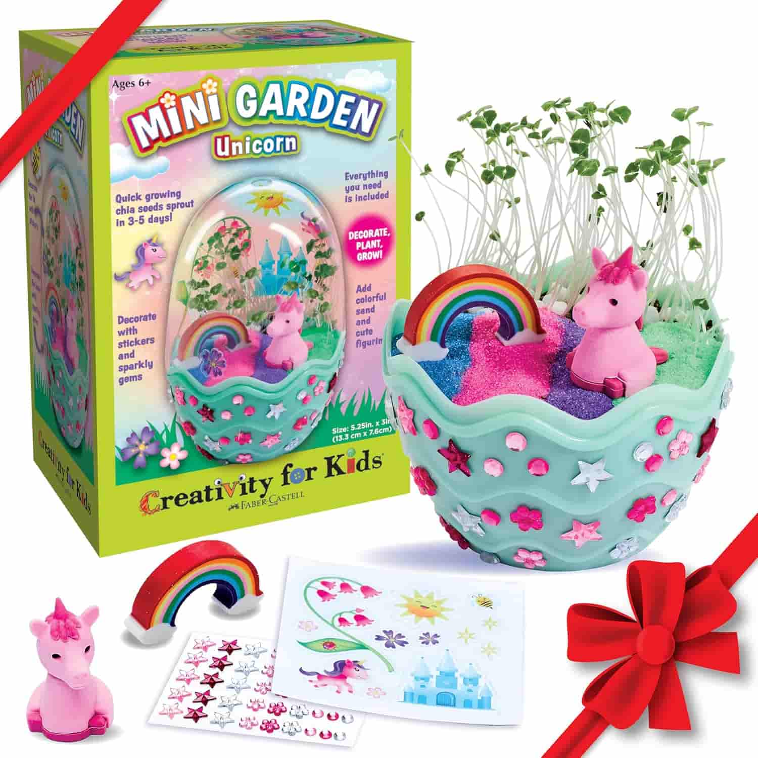 Mini Garden Unicorn kit includes a decorated planter, unicorn figurine, rainbow, plant seeds, soil, and stickers; packaging highlights contents and finished example.