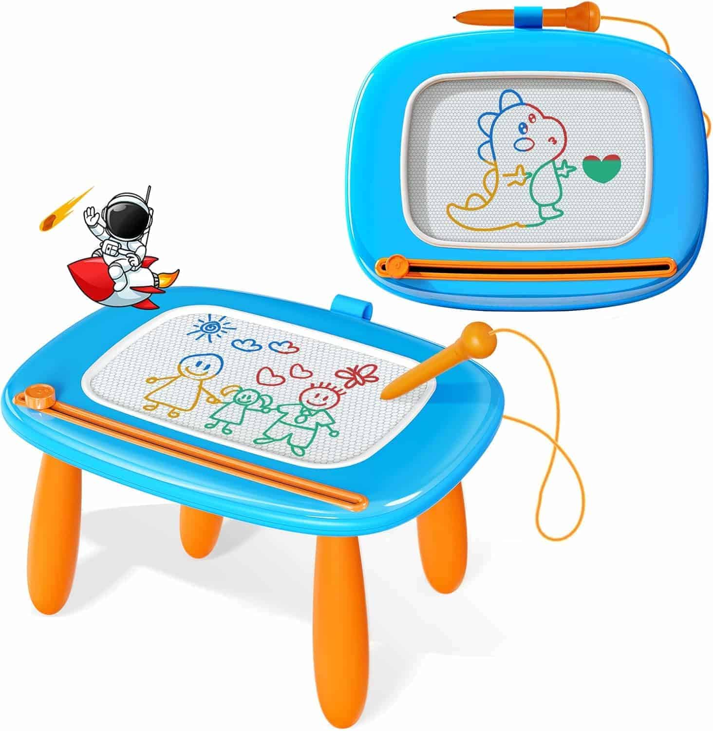 Blue and orange magnetic drawing board with four legs, stylus attached by a string, and colorful doodles of people and a dinosaur on the screen. An astronaut cartoon is in the corner.