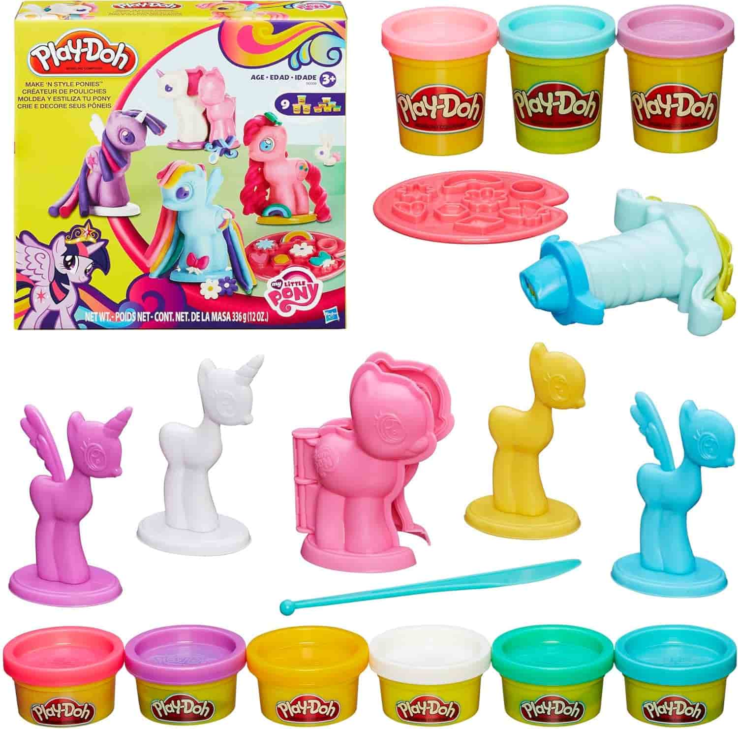 Play-Doh My Little Pony set with four colored cans, character molds, a sculpting tool, and accessories arranged beside the packaging box.