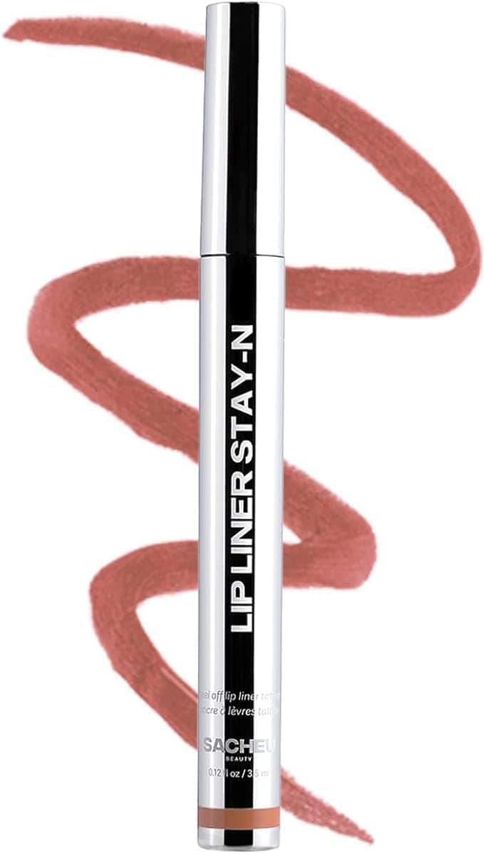 A silver and black lip liner pencil labeled "Lip Liner Stay-N" stands upright in front of a zigzag line of mauve lip color.