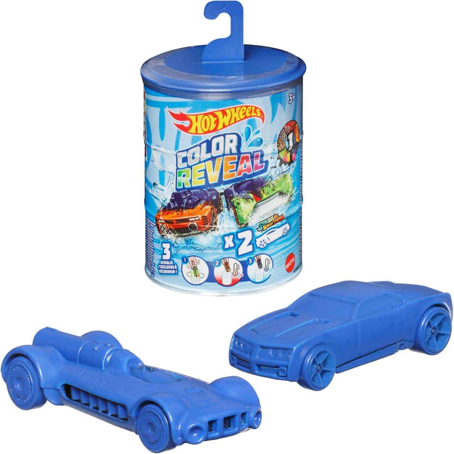 Two blue toy cars are displayed in front of a cylindrical Hot Wheels Color Reveal packaging container featuring colorful graphics and a hanging hook.